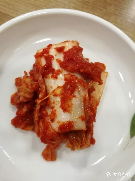 金明子八带鱼馆(烟台店)辣白菜图片