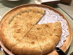 馕坑芝麻馕-巴扎美食·新疆菜·西域歌舞表演餐厅(新疆大厦店)