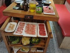 -明何记涮牛肚(品牌首店隋唐植物园南门古城路店)