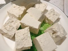 石磨手掰豆腐-三人行骨头王火锅(长寿店)
