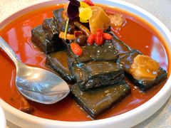 猴头菇鲍汁瑶柱扒制黑豆腐-肴约·花园式餐厅(湖里店)