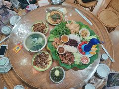-沐毫傣泐云南菜孔雀宴•手抓饭傣味烧烤(曼听公园店)