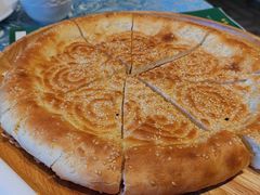 馕坑芝麻馕-巴扎美食·新疆菜·西域歌舞表演餐厅(新疆大厦店)
