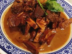 招牌小碗牛肉炖板筋-京门老爆三·铜锅涮肉 爆肚(望京店)