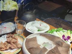 -老牌坊云南鱼豆花火锅(哈西万达店)