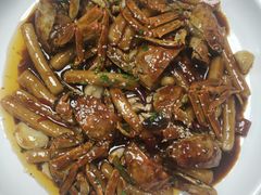 蟹炒年糕-七的湖·晚芳亭·阳澄湖农家菜·大闸蟹(莲花岛店)