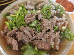 碗碗嫩牛肉翘脚-大众跷脚牛肉馆·非遗传承单位(峨眉山店)