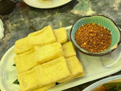 蒜香包浆豆腐-浩海火燒雲傣家菜(芮欧百货店)
