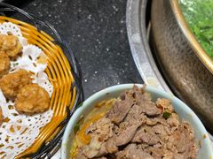 -明何记涮牛肚(品牌首店隋唐植物园南门古城路店)