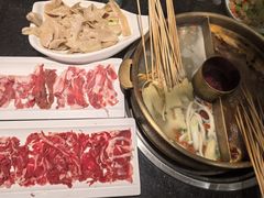 -明何记涮牛肚(品牌首店隋唐植物园南门古城路店)