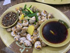 葱姜炒花螺-贞姨美食·老字号海鲜大排档