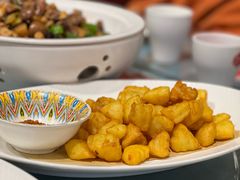 阳光锅巴土豆-石榴红了·非遗酥皮烤包子·新疆菜(瑞豪店)