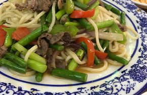 Garlic Shoots Stir-Fried with Lamb over Noodles