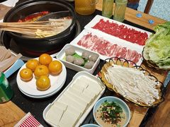 -明何记涮牛肚(品牌首店隋唐植物园南门古城路店)
