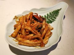 梭子蟹炒年糕-卯时·龙光雅宴·精致锡帮菜(惠山古镇店)