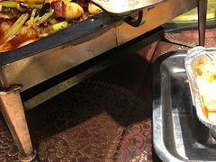 新疆铁盘烤鱼-巴依兄弟西域美食(机场店)