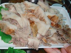 -明何记涮牛肚(品牌首店隋唐植物园南门古城路店)