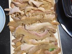 -明何记涮牛肚(品牌首店隋唐植物园南门古城路店)