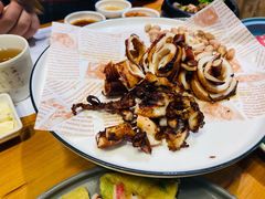 铁板香辣鱿鱼-草家酱蟹炭火烤肉店(珲春南路一店)