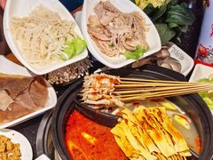-明何记涮牛肚(品牌首店隋唐植物园南门古城路店)