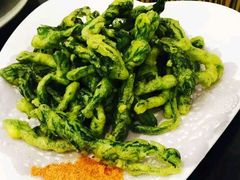 炸刺芽-闯关东东北农家菜(崂山石老人店)