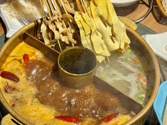 -明何记涮牛肚(品牌首店隋唐植物园南门古城路店)