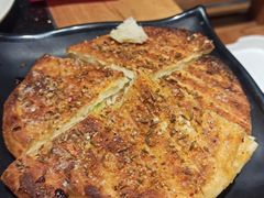 -明何记涮牛肚(品牌首店隋唐植物园南门古城路店)