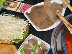 -明何记涮牛肚(品牌首店隋唐植物园南门古城路店)