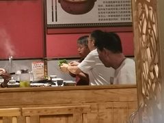 -明何记涮牛肚(品牌首店隋唐植物园南门古城路店)