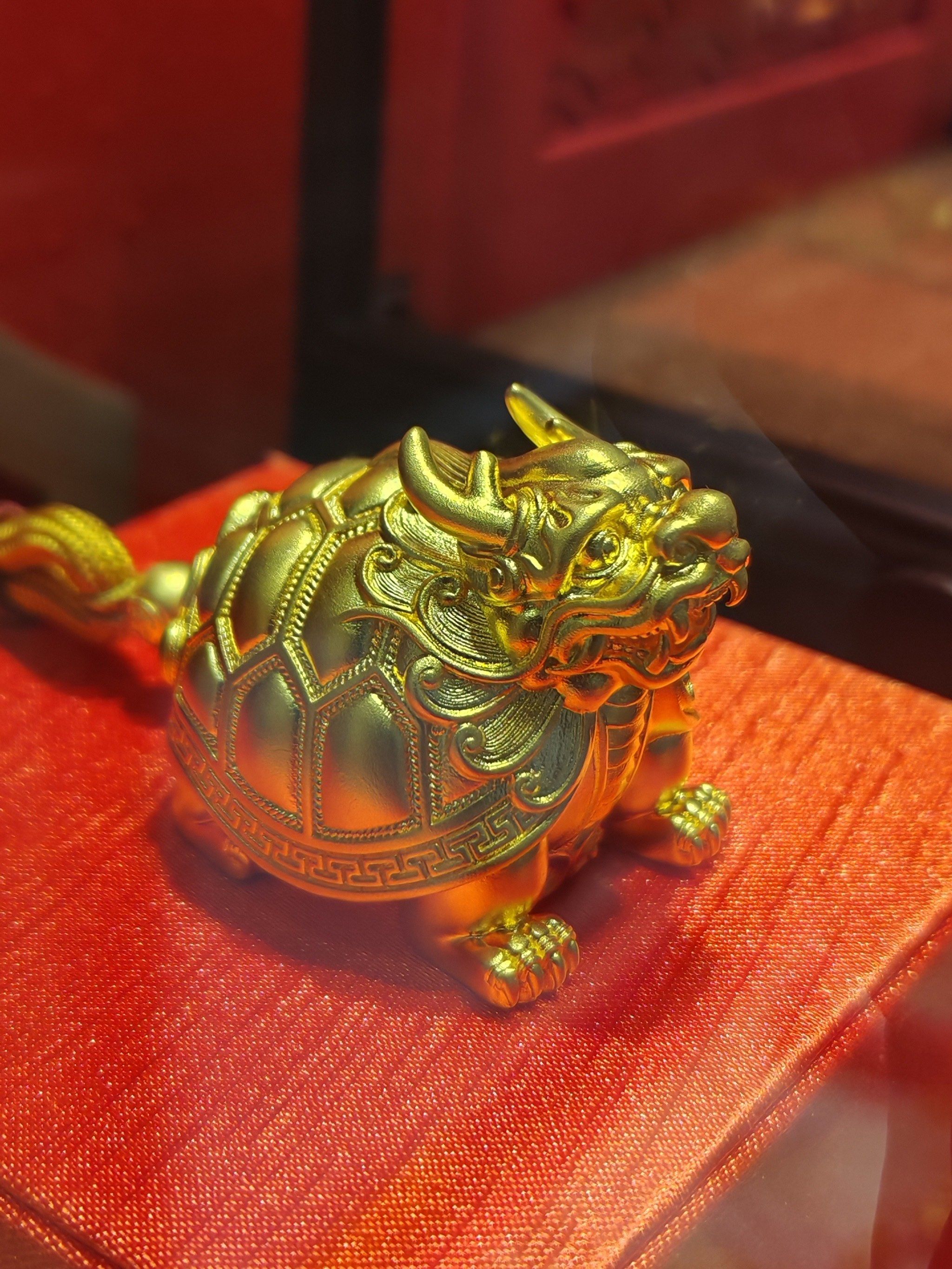 周生生龙龟手把件