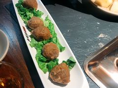 撒尿牛丸-老牌坊云南鱼豆花火锅(哈西万达店)