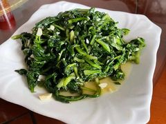 辣炒茼蒿-卯时·龙光雅宴·精致锡帮菜(惠山古镇店)