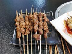 -明何记涮牛肚(品牌首店隋唐植物园南门古城路店)