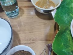 -沐毫傣泐云南菜孔雀宴•手抓饭傣味烧烤(曼听公园店)