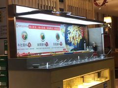 -明何记涮牛肚(品牌首店隋唐植物园南门古城路店)