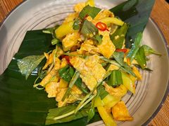 傣味芒果舂荷包蛋-云海肴·汽锅鸡·云南代表菜(天津国金汇店)
