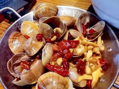 炒黄蚬子-金太阳海鲜烧烤·本地人餐厅(东纬路旗舰店)