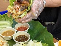-沐毫傣泐云南菜孔雀宴•手抓饭傣味烧烤(曼听公园店)