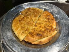 烤饼-明何记涮牛肚(品牌首店隋唐植物园南门古城路店)