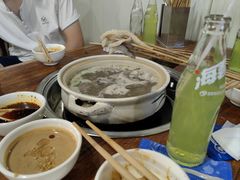 -明何记涮牛肚(品牌首店隋唐植物园南门古城路店)