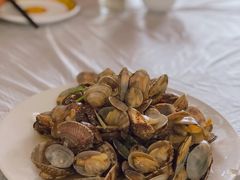 辣炒蛤蜊-1910老鲁味海鲜·戳子肉·青岛菜(金沙滩店)