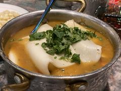 牛牛霸鸡脚煲-浩海火燒雲傣家菜(芮欧百货店)