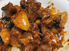 土豆烧牛腩-华春餐馆(鱼山路店)