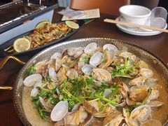 鲜炒蚬子-曼听小寨海鲜烧烤·大连辣炒大王(盖州街店)