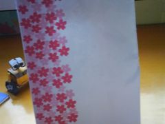 袋子，里面装了2枚泡芙。-樱花糕坊(万松园店)