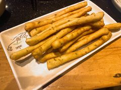 茴香小油条-明何记涮牛肚(品牌首店隋唐植物园南门古城路店)