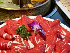 -明何记涮牛肚(品牌首店隋唐植物园南门古城路店)
