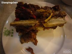 盛入骨碟中的羊羯子-柿子树炭烤羊腿(金台路店)