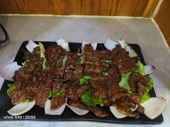 -明何记涮牛肚(品牌首店隋唐植物园南门古城路店)