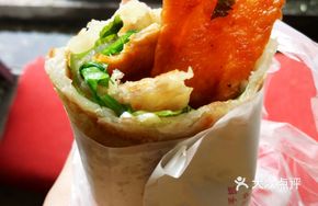 Hand-held Pancake with Egg, Pork Tenderloin, Bacon, Sesame Seed Paste, and Grilled Sausage